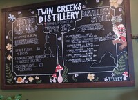 The postings on the menu board at Twin Creeks Distillery in Franklin County, Virginia, demonstrate the area's claim to be the 'Moonshine Capital of the World.' Photo Courtesy of Victor Block.