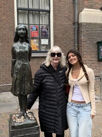  The author and her aunt pose beside a sculpture of Anne Frank created by Mari Andriessen in 1977 in Amsterdam, the Netherlands. Photo courtesy of Carl H. Larsen. 