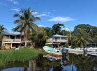  Tour boats await curious visitors at the dock in sleepy Monkey River Village, Belize. Photo courtesy of Lesley Frederikson. 