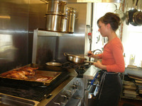  Chef Julie Simon prepares food in the kitchen at Thomas Hill Organics in Paso Robles, Calif. Photo courtesy of Beverly Mann. 