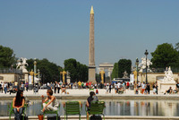 The obelisk in the Place de la Concorde with the Arc de Triomphe behind adds a perfect backdrop to people-watching in Paris' Tuileries. Photo courtesy of Priscilla Lister.