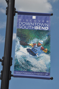 A banner in downtown South Bend, Ind., depicts a kayaker on the East Race Course, a manmade whitewater run on the side of the St. Joseph River. Photo courtesy of Brian Clark.
