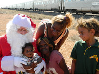 Children in a small Australian village greet the man they call "Ho Ho" during a stop by Indian Pacific Railway's Christmas Train. Photo courtesy of John Blanchette.