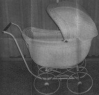 . Vintage wicker baby carriage was made circa 1920. 