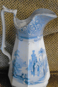  Blue-and-white Staffordshire pitcher was decorated with Cologne pattern. 