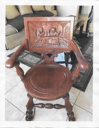  Chairs decorated with carved scenes were popular around 1900. 