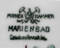  The mark with crossed hammers and a crown represents the town Pirkenhammer. 