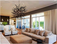 . Designed to accommodate a crowd, an ample furniture arrangement floats under a work-of-art light fixture. Photo: Courtesy Kenneth Cobonpue. 