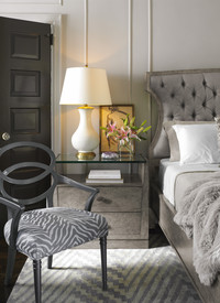  Gray is the antithesis of 'gloom' in an elegant bedroom that practically guarantees a good night's sleep. Photo: Courtesy Thomas & Gray. 