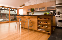  Eco-savvy flooring of sustainable bamboo helps make a contemporary kitchen easy on the eyes &#8212; and the breathing. Photo courtesy of "Kennedy Green House." 