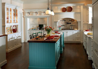  A very personal kitchen is centered with an island painted a color the owner remembered from a trip to Savannah. &mdash;Photo courtesy Plain and Fancy Cabinetry. 