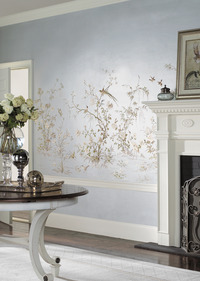 Silvered and sparkling, a wallpaper mural inspired by an antique Chinese embroidery brightens this entire room. Photo: Courtesy York.