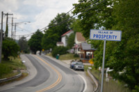  The sign for the village of Prosperity sits along state Route 18. Photo credit Justin Merriman. 