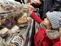  Like her immigrant Italian grandparents, Salena Zito started bringing her grandchildren to shop for the ingredients for the Feast of the Seven Fishes so they can carry the tradition on to the next generation. Photo courtesy of Shannon M. Venditti. 