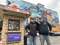  Yousef Saeed and Richard Gizzi stand in front of the 20th and Penn Avenue parking lot, where for the next 10 days they will spend almost as much time carrying customers' bags from Wholey's as they will parking cars. Photo courtesy of Shannon M. Venditti. 
