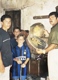  Frank Tropiano returned to the one-room home where he grew up in Siderno, Italy, when his three boys were teenagers in 1999. Submitted photo. 